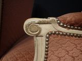 a close up view of a chair with pearls on it