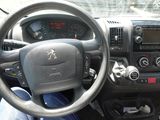 dashboard view of a car with a steering wheel and dashboard controls