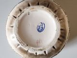 a white plate with a blue and white design on it