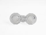 pair of clear glass knobs on a white surface