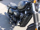 a motorcycle that is parked on the side of the street
