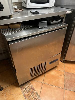 a microwave sitting on top of a counter in a kitchen