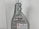 a bottle of cleaner on a table with a white background
