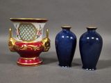 two vases sitting next to each other on a table