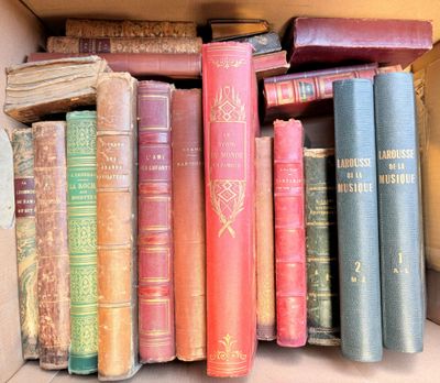 many old books in a box on the shelf