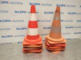two orange and white traffic cones sitting on top of each other