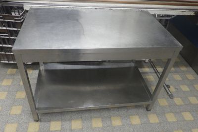 a stainless steel table with a shelf underneath it