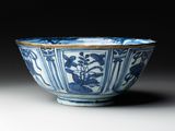 a blue and white bowl sitting on a table
