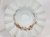 a white plate with a floral design on it