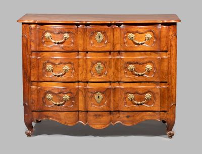an image of a wooden chest of drawers with brass handles