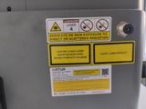 a close up of a metal box with a warning sign on it