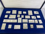 a blue case with a lot of silver coins in it