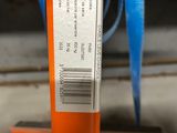 a close up of a blue and orange object with a tag on it