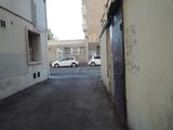 a white car parked on the side of the street
