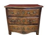 an antique chest of drawers with a wooden top and brass hardware