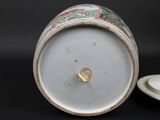 a close up of a white and green cup and saucer