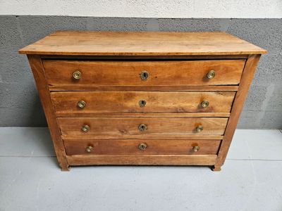 an old wooden chest of drawers sitting on top of a white floor