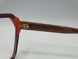 a close up of a pair of glasses on a white surface