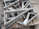 many pieces of metal sitting on a pallet in the street