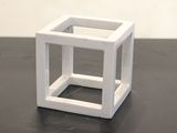 a small white cube that is on a table