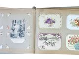 an open book with a bunch of cards in it