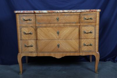 an image of a dresser with a marble top