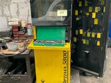 two machines that are sitting next to each other on the floor
