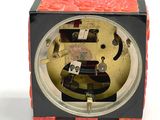 a black and red box with a clock inside of it
