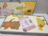 two boxes that have a teddy bear on them