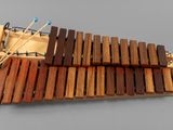 une image représentant un instrument de musique fabriqué en bois et composé de baguettes en bois