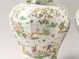 pair of chinese vases with animals and flowers painted on them
