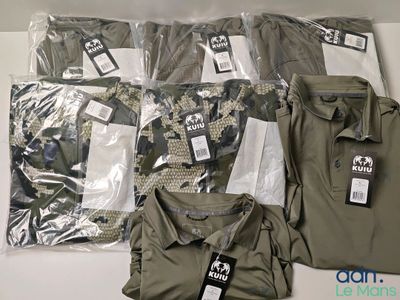 a lot of men ' s clothing on display on a table