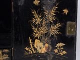 a small black box with a painting on it