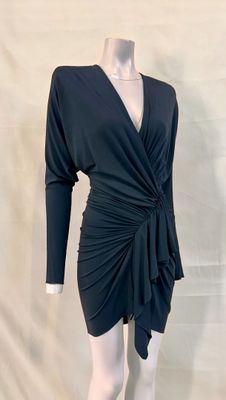 the dress is black and has long sleeves and a v - neck