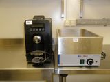 a machine that is sitting on a table in a kitchen