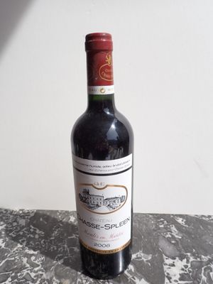 a bottle of wine that is sitting on a table
