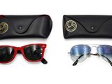 une paire de lunettes de soleil et un étui à lunettes de soleil posés l'un à côté de l'autre