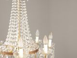 a close up of a chandelier with candles on it