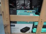 many boxes of electronics on a shelf in a store