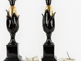 pair of black and gold corn lamps on marble bases