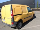 a yellow van that is parked in a parking lot