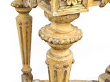 a small table with a clock on top of it