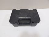 a close up of a black plastic box on a white surface