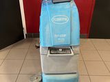 an image of a blue floor scruber in a room