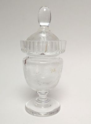 clear glass jar with a lid on a white surface