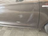 a close up of a car door with a sticker on it