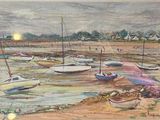 many boats that are sitting on the shore of the water