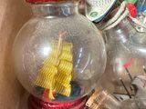 a box full of glass bottles with a ship in it