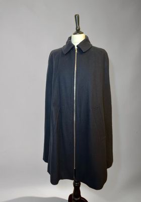 the coat is black and has a zipper on the front