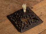 a small animal that is sitting on top of a metal object